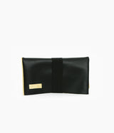 golden clutch bag with black leather reversible bag