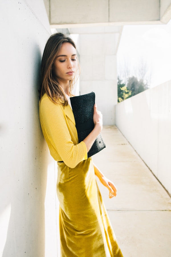 outfit with black clutch bag yellow skit in velvet